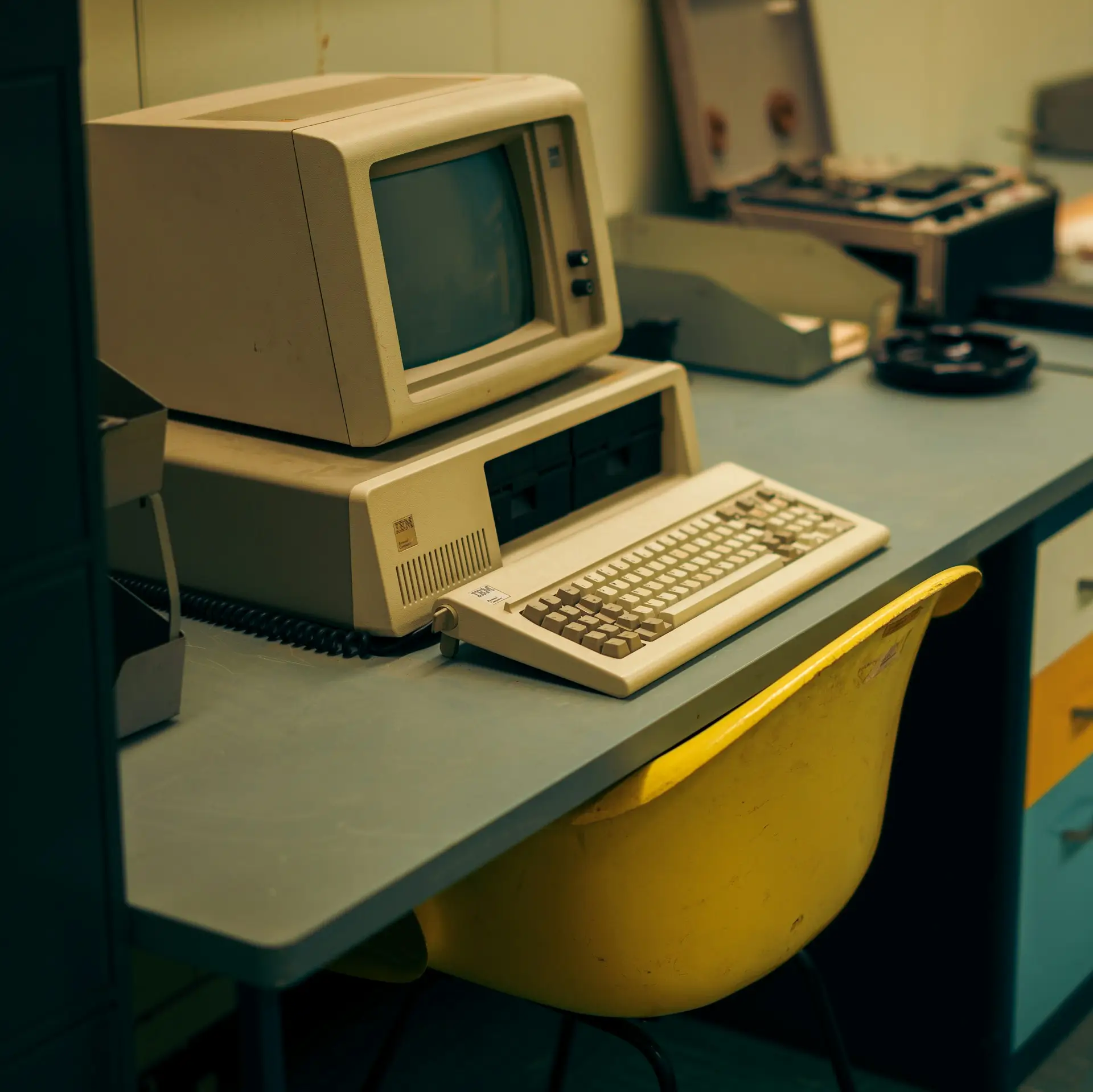 an old pc setup over a vintage desktop